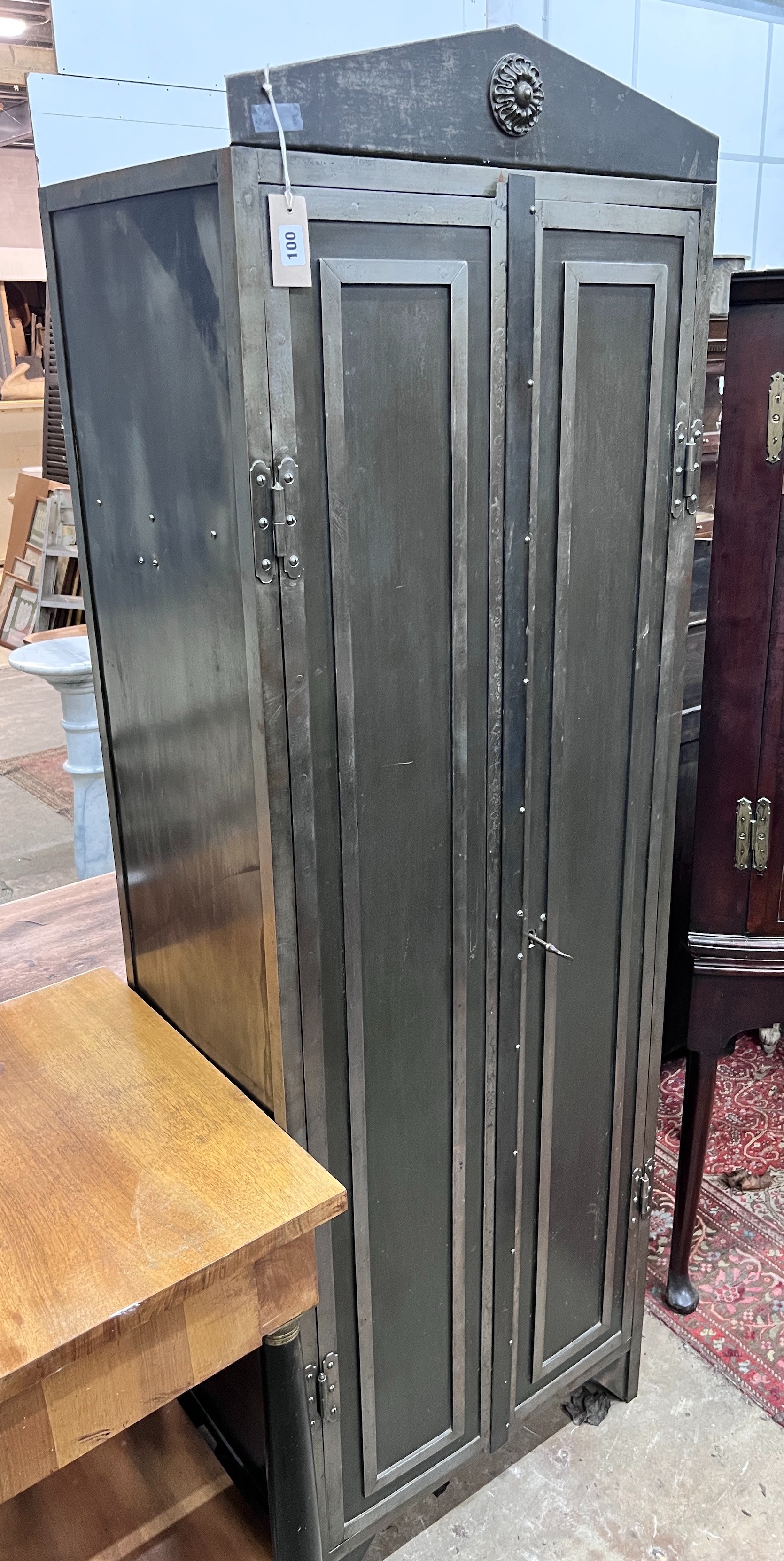 An Indian style metal two door cupboard, width 60cm, depth 41cm, height 186cm *Please note the sale commences at 9am.